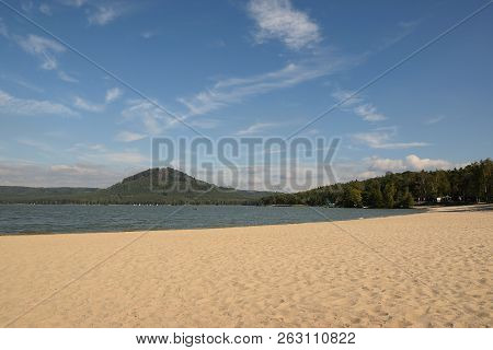 Machovo Jezero Lake With Sandy Beach And Borny Hill On Background In Czech Tourist Area Named Machuv