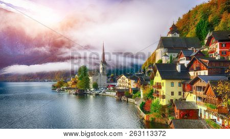 Scenic View Of Famous Hallstatt Mountain Village With Hallstatter Lake. Sunny Autumn Sunrise On Hall
