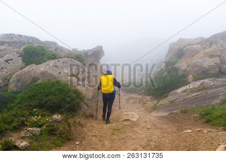 Backpackers On Foggy Trekking Path In Annapurna Conservation Area, Nepal