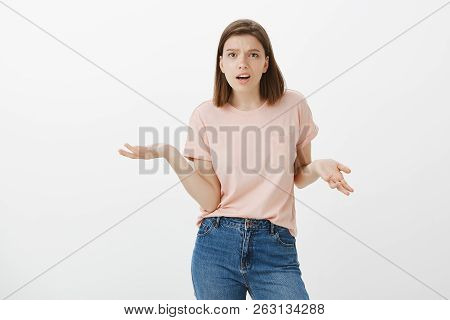 Wtf Are You Talking About. Portrait Of Displeased Pissed European Female, Standing In Angry Pose, Sh