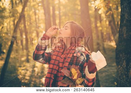 Young Woman Blowing Nose At Nature. Sick People Has Runny Nose. Woman With Allergy Symptoms Blowing 