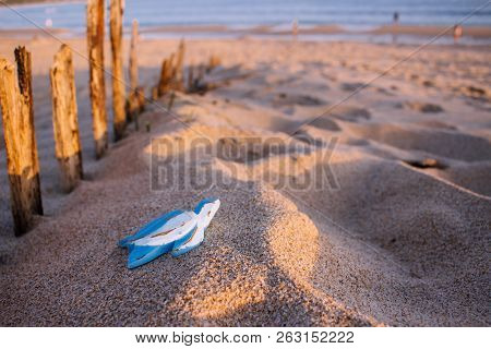 Blue Wooden Turtle On The Beach. 