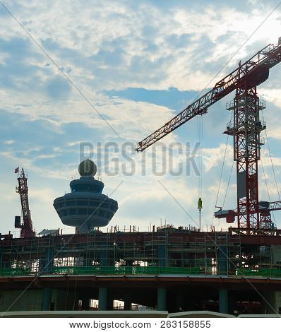 Construction Activity At A Construction Site Of A Modern Airport Terminal. Singapore