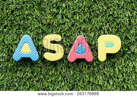 Color Alphabet Letter In Word Asap (abbreviation Of As Soon As Possible) On Artificial Green Grass B
