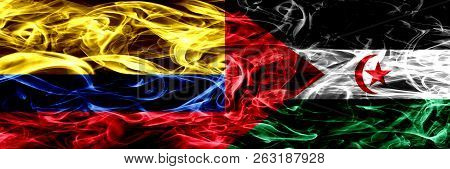 Colombia Vs Sahrawi Smoke Flags Placed Side By Side. Thick Colored Silky Smoke Flags Of Colombian An