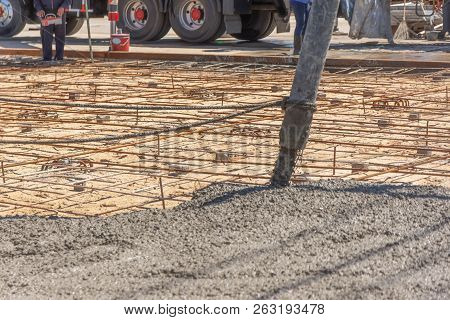 Pouring Ready-mixed Concrete From Mixing Mobile The Concrete Mixer From Concrete Pump And Placing Bo