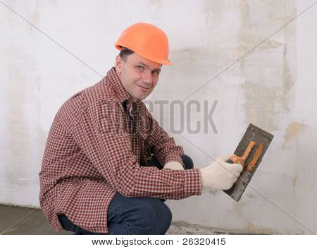 ช่างก่อสร้างแพร่กระจายคอนกรีตเปียก