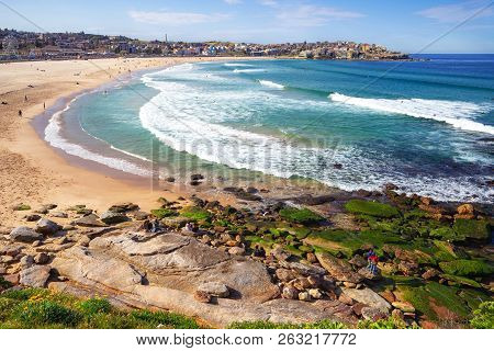 People Relaxing On The Bondi Beach In Sydney, Australia. Bondi Beach Is One Of The Most Famous Beach