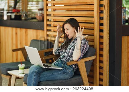 Angry Screaming Sad Upset Girl In Outdoors Street Coffee Shop Wooden Cafe Sitting With Modern Laptop