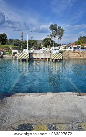 The Corinth Canal connects the Gulf of Corinth with the Saronic Gulf in the Aegean Sea in Greece. It cuts through the narrow Isthmus of Corinth and separates the Peloponnese from the Greek mainland