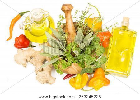 Fresh Green Herbs And Aromatic Cooking Oil