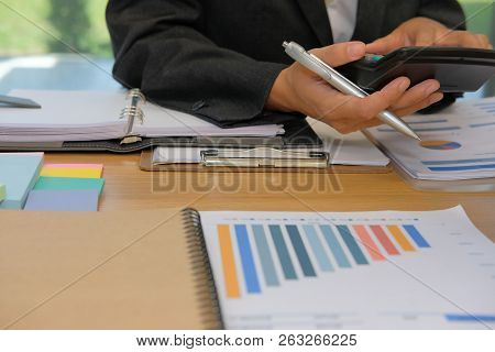 Financial Adviser Working With Calculator At Office. Accountant Doing Accounting & Calculating Reven