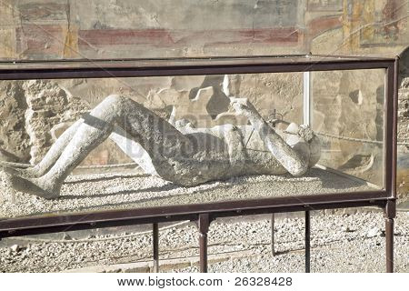 Pompeii was destroyed by the eruption of Mt. Vesuvius during 2 days in 79AD. This is a plaster cast of one of the victims displayed to the public on site in a glass case.