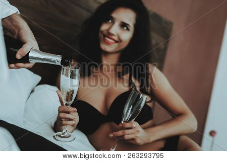 Brunette Girl. Person With Glasses Champagne. Mans Shirt. Man Pouring Glass Champagne. Woman With Se