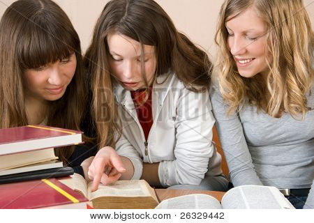 Three beautiful girls learning together