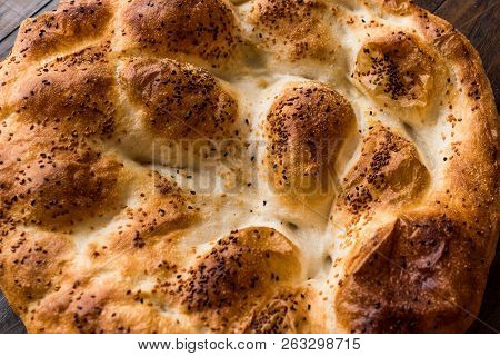 Turkish Ramadan Bread - Ramazan Pidesi On Wooden Surface / Pide