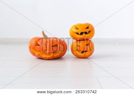 Halloween Pumpkins. Funny Jack Olantern On The Light Room