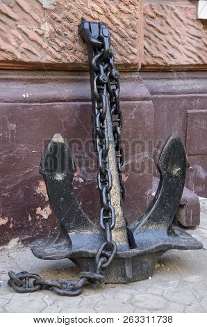 Iron Anchor On The Fence. Metal Skulpture, Street Design