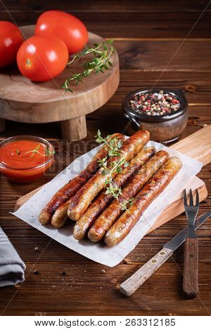 Pork Chipolata. Close-up View Of Fried Sausages. Meat Dish