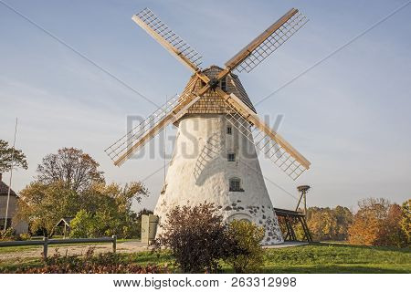 Restored Old Windmill On The Mountainside. Autumn Sunny Day.