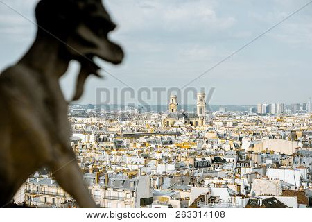 Aerial Panoramic View Of Paris With Gargoyle Sculpture On The Notre-dame Cathedral During The Mornin