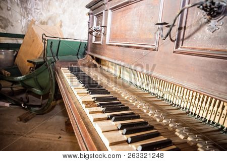 Old Wooden Broken Piano. Abstract Inside Retro Photo.