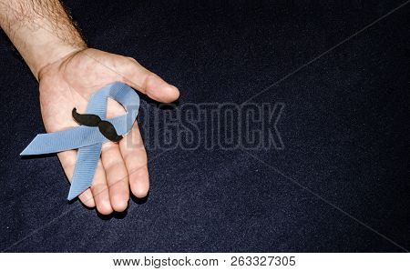 Man Holding A Blue Ribbon, Blue November Concept