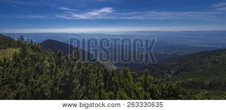 Panoramic View From Tatra Mountains Trail On Valley With Tatranska Lomnice And Blue Misty Slopes Of 