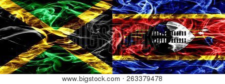 Jamaica Vs Swaziland, Swazi Smoke Flags Placed Side By Side. Thick Colored Silky Smoke Flags Of Jama