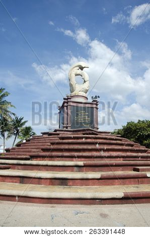 Sculpture Of Dolphins On The Waves Monument In Laem Thaen Cape At Bang Saen Beach In Chonburi, Thail