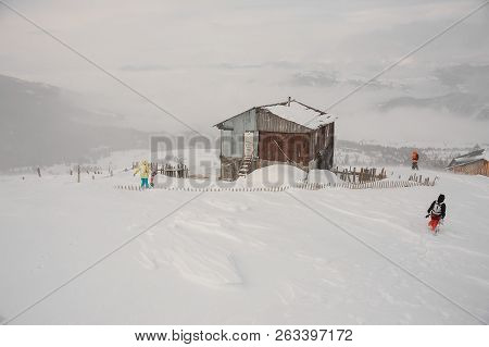 Day Winter Landscape Of Snow Covered House On The Mountain Hill On The Popular Tourist Resort In God