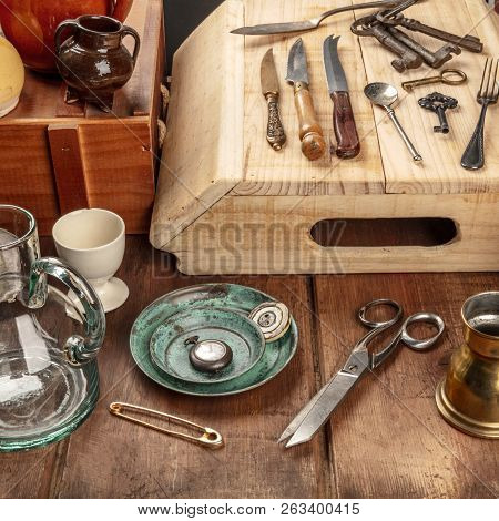 A Photo Of Many Vintage Objects, Flea Market Stuff On A Wooden Table
