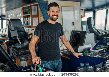 Marine Navigational Officer Is Maneuvering Ship Or Vessel