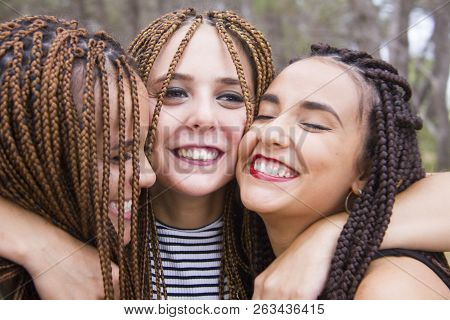 Three Young And Beautiful Girls, With Braided Hair, Having Fun