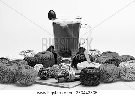 Homemade Mulled Wine Concept. Glass With Mulled Wine Or Hot Tea With Grape, Cinnamon And Honey On Wo