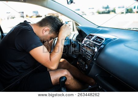 Closeup Portrait Tired Young Handsome Man With Short Attention Span, Driving His Car After Long Hour