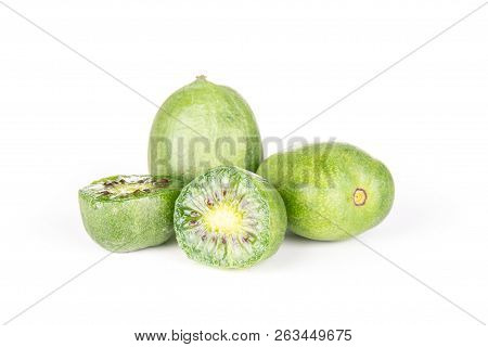 Group Of Two Whole Two Halves Of Fresh Green Mini Baby Kiwi Fruit Isolated On White Background