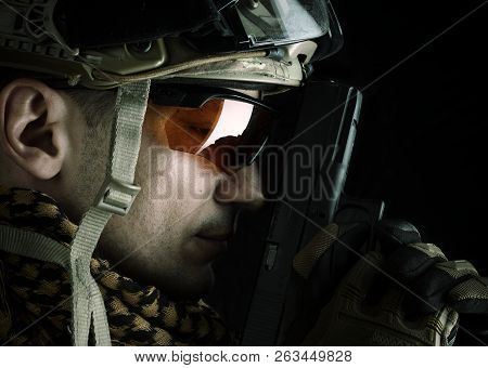 Macro View Of Military Man With Gun