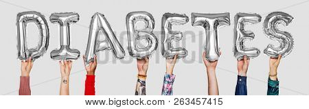 Hands showing diabates balloons word
