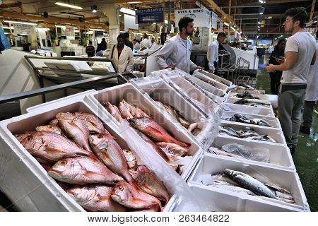 London, Uk - July 8, 2016: Vendors Sell Sea Food At Billingsgate Fish Market In London, Uk. The Mark