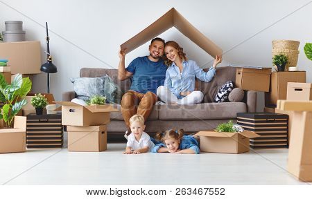 Appy Family Mother Father And Children Move To A New Apartment And Unpack Boxes
