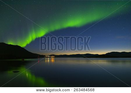 Landscape With Aurora Borealis And Tornetrask Lake. Northern Sweden