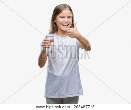 Young beautiful girl drinking glass of water over isolated background happy with big smile doing ok sign, thumb up with fingers, excellent sign
