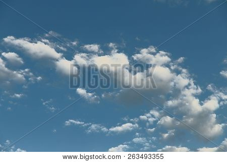 The Background Is Natural. Blue Sky And Clouds. Cropped Shot, Isolated, Close-up, Blurred