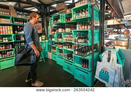 Copenhagen, Denmark - Sept 5: Man Thinking About Beer Inside Colorful Design Store By Popular Mikkel