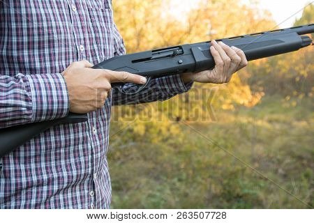Male With Semi-automated Shotgun In The Autumn Forest Ready To Hunting, Close Up View