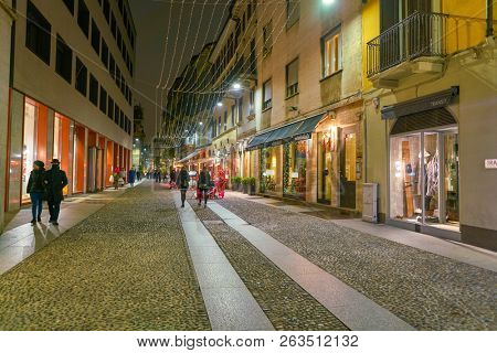 MILAN, ITALY - CIRCA NOVEMBER, 2017: a street in Milan at night. Milan is a city in northern Italy.