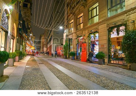 MILAN, ITALY - CIRCA NOVEMBER, 2017: a steet in Milan in the night. Milan is a city in northern Italy.
