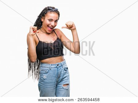 Young braided hair african american with pigmentation blemish birth mark over isolated background looking confident with smile on face, pointing oneself with fingers proud and happy.