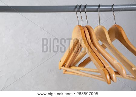 Wood Empty Hangers On Rack With Rustick Background, Copy Space
